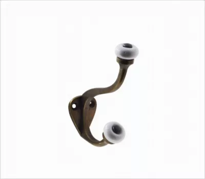 Patère en zamak effet rouillé à fixer 1 tête en porcelaine Bar Plus